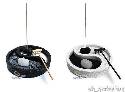 yin yang forme zen jardin avec chandelles